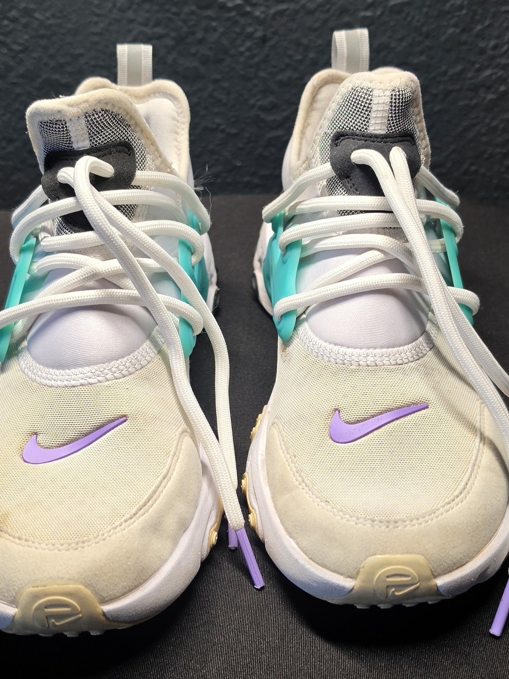 Nike Kids Cream Sneakers with Purple Swoosh and Teal Accents